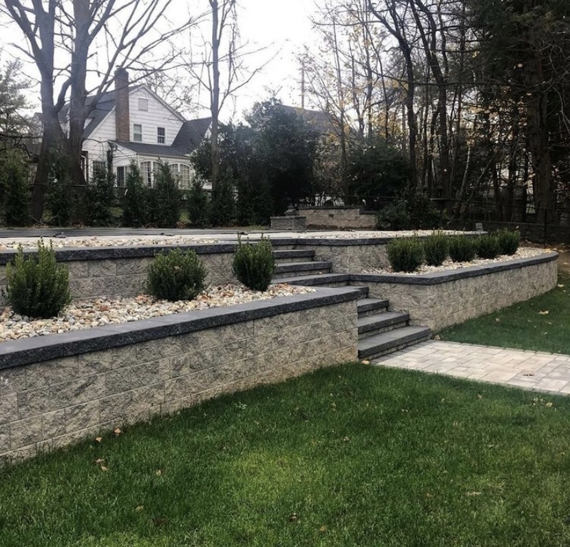Tiered retaining wall hardscape with steps and landscaping in Old Tappan, Bergen County, NJ, by Masonry Pro Construction