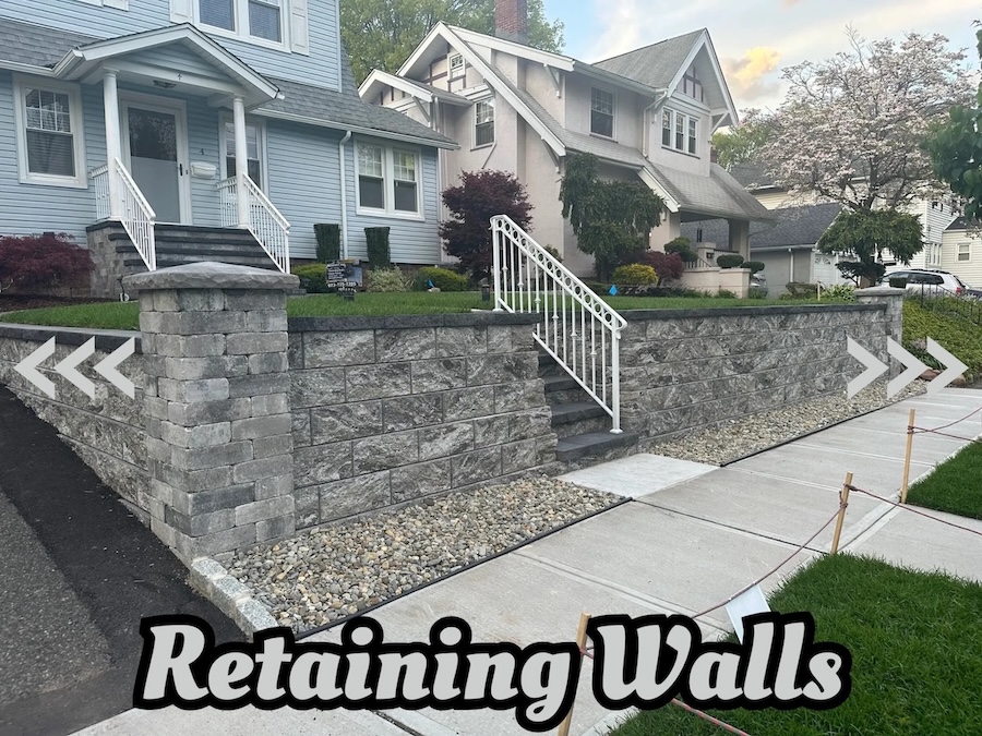New retaining wall installation with stone steps in front of a residential home in Nutley, NJ, by Masonry Pro Construction